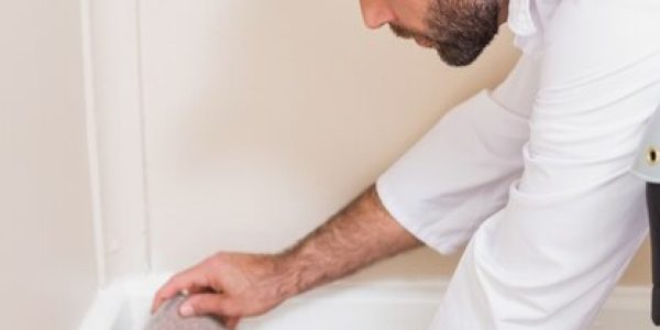 handyman-laying-down-carpet_13339-94179