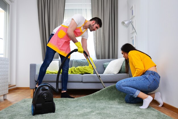 relationship-married-life-household-works-duties-gender-equality-concept-man-cleaning-while-woman-is-assisting-him_378362-88